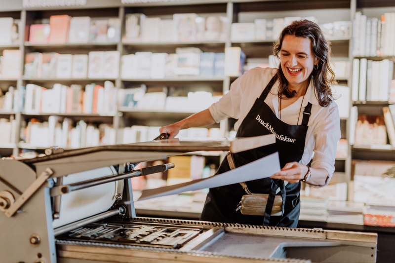 Employee at a printing machine