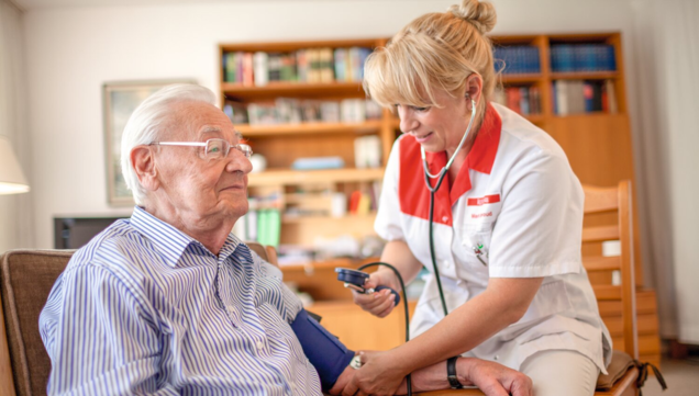 Nurse measures patient's blood pressure