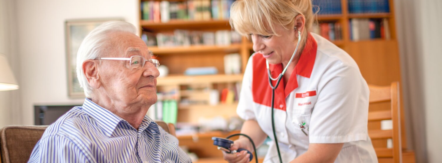 Nurse measures patient's blood pressure