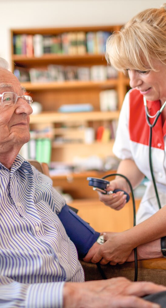 Nurse measures patient's blood pressure