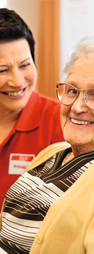 Caregiver chatting with senior