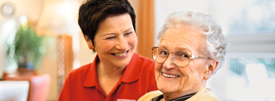 Caregiver chatting with senior