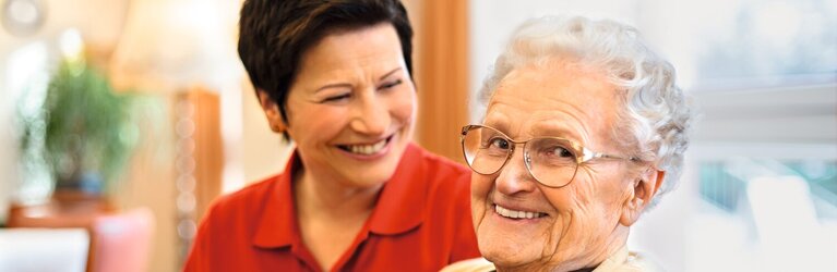 Caregiver chatting with senior