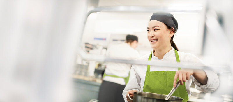 Cook stirs in cooking pot