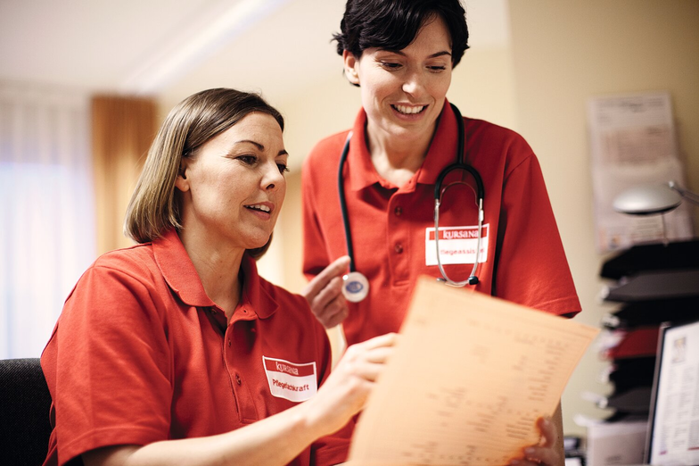 Two nurses discuss duty schedule