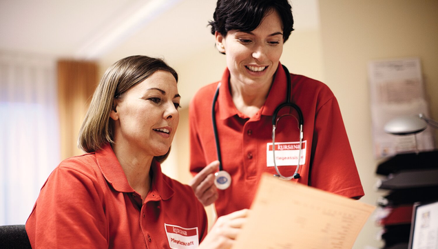 Two nurses discuss duty schedule