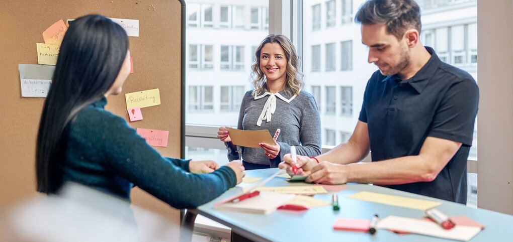 Team meeting with flipchart and notes in office