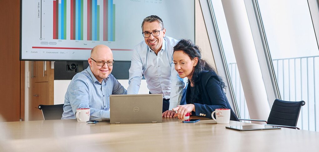Three people discussing quality and safety processes