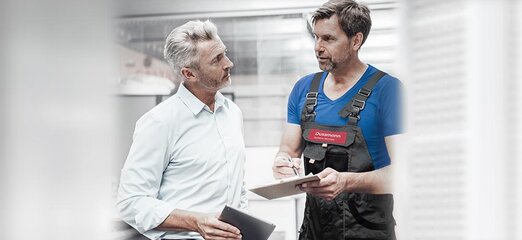 Engineers consult at construction site