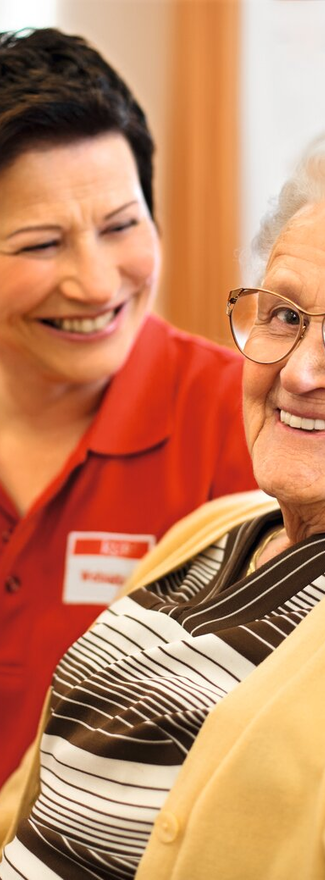 Caregiver chatting with senior