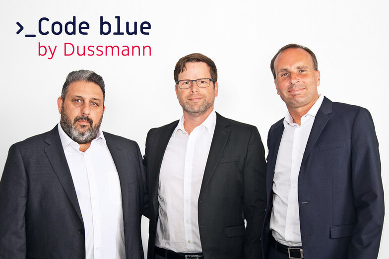 Group photo with founder of Code Blue Ltd., Christian Milde, Managing Director Code Blue GmbH and Wolf-Dieter Adlhoch, CEO of Dussmann Group